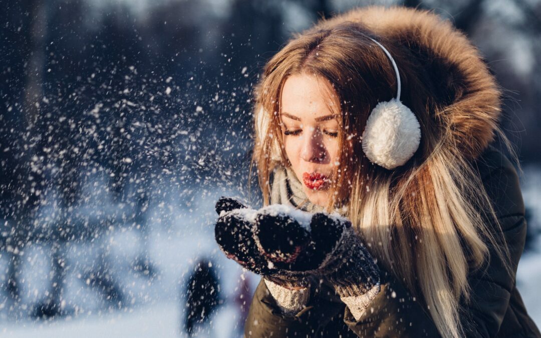 woman playing in the snow