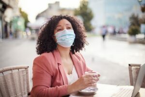 woman with allergy wearing face mask
